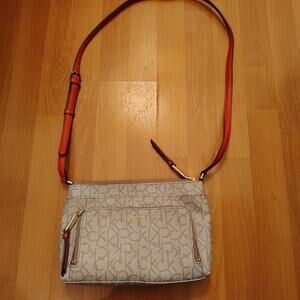 Calvin Klein Monogram Crossbody Bag — Red Handle, Multi‑Pocket, Taupe
